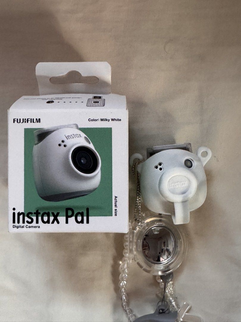 Fujifilm Instax Pal Digital Camera Milky White (Category: Cameras) located in Muntinlupa City. Submitted by ayebmedina (Listing ID 1455796632, Image 3). Description: - Fujifilm Instax Pal digital camera - Color: Milky White - Includes original box and packaging - Cute and compact design - Ideal for taking fun, memorable photos - Ready for its new owner! - RFS: need funds .