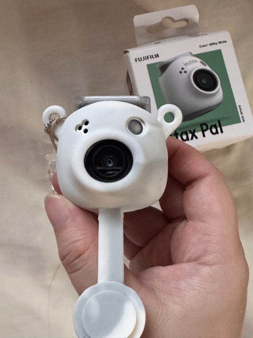 Fujifilm Instax Pal Digital Camera Milky White (Category: Cameras) located in Muntinlupa City. Submitted by ayebmedina (Listing ID 1455796632, Image 1). Description: - Fujifilm Instax Pal digital camera - Color: Milky White - Includes original box and packaging - Cute and compact design - Ideal for taking fun, memorable photos - Ready for its new owner! - RFS: need funds .