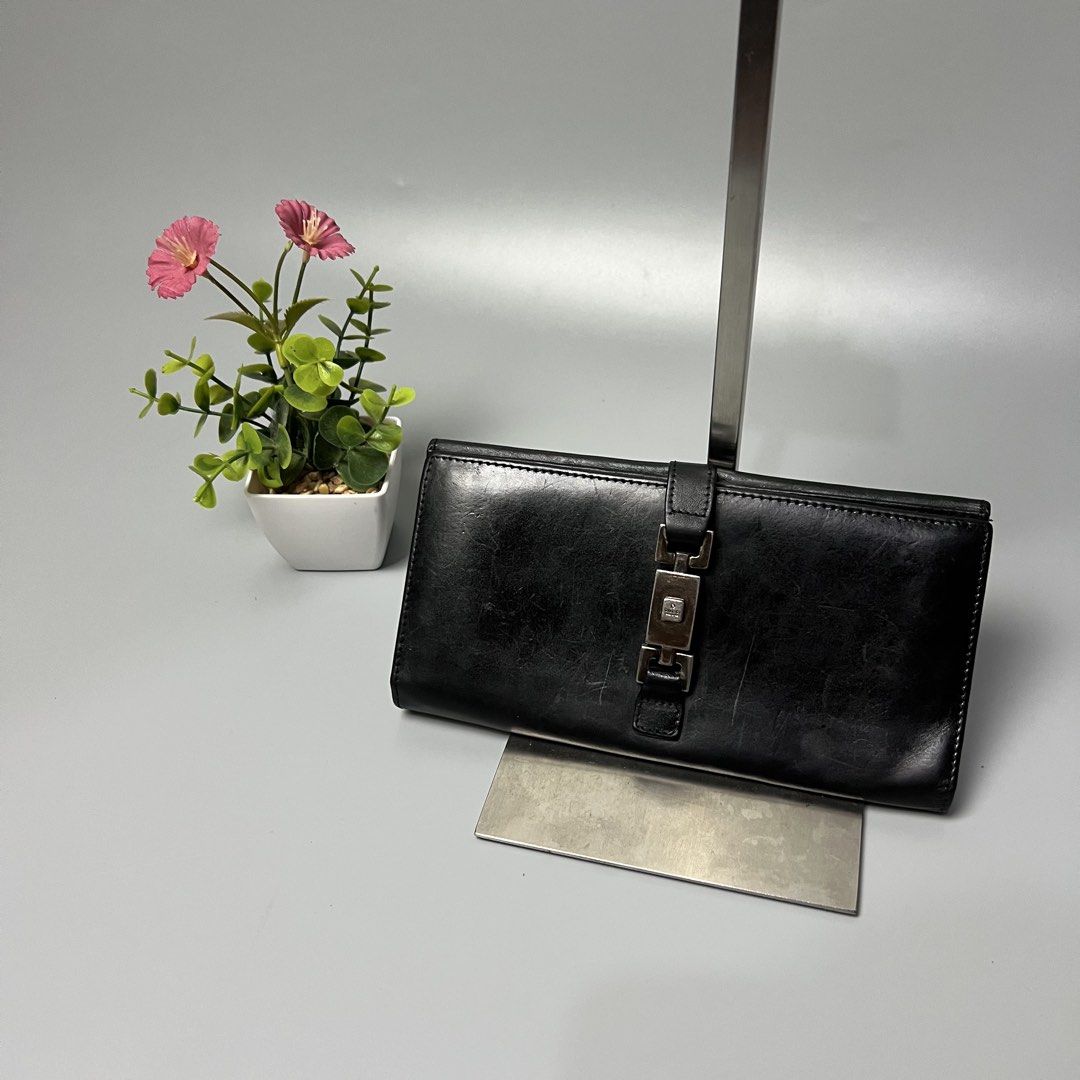 Gucci Black Leather Long Wallet (Category: Luxury Bags & Wallets) located in Bago City. Submitted by g___shop (Listing ID 1455796877, Image 1). Description: - Authentic Gucci black leather long wallet - Iconic horsebit hardware - Ample card slots for organization - Serial number: 035-1502-2134 - Made in Italy - Please check photos for detailed condition.