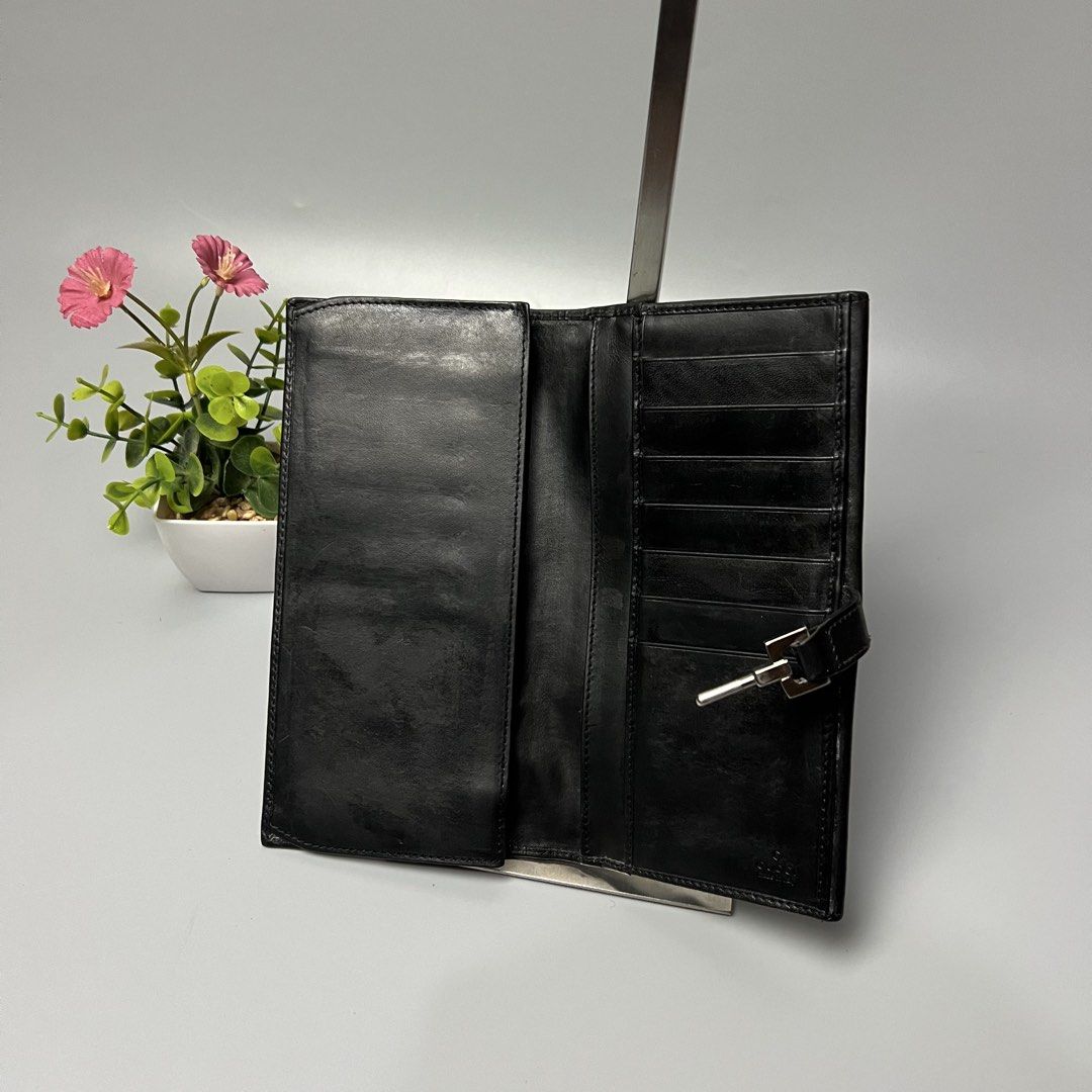 Gucci Black Leather Long Wallet (Category: Luxury Bags & Wallets) located in Bago City. Submitted by g___shop (Listing ID 1455796877, Image 3). Description: - Authentic Gucci black leather long wallet - Iconic horsebit hardware - Ample card slots for organization - Serial number: 035-1502-2134 - Made in Italy - Please check photos for detailed condition.