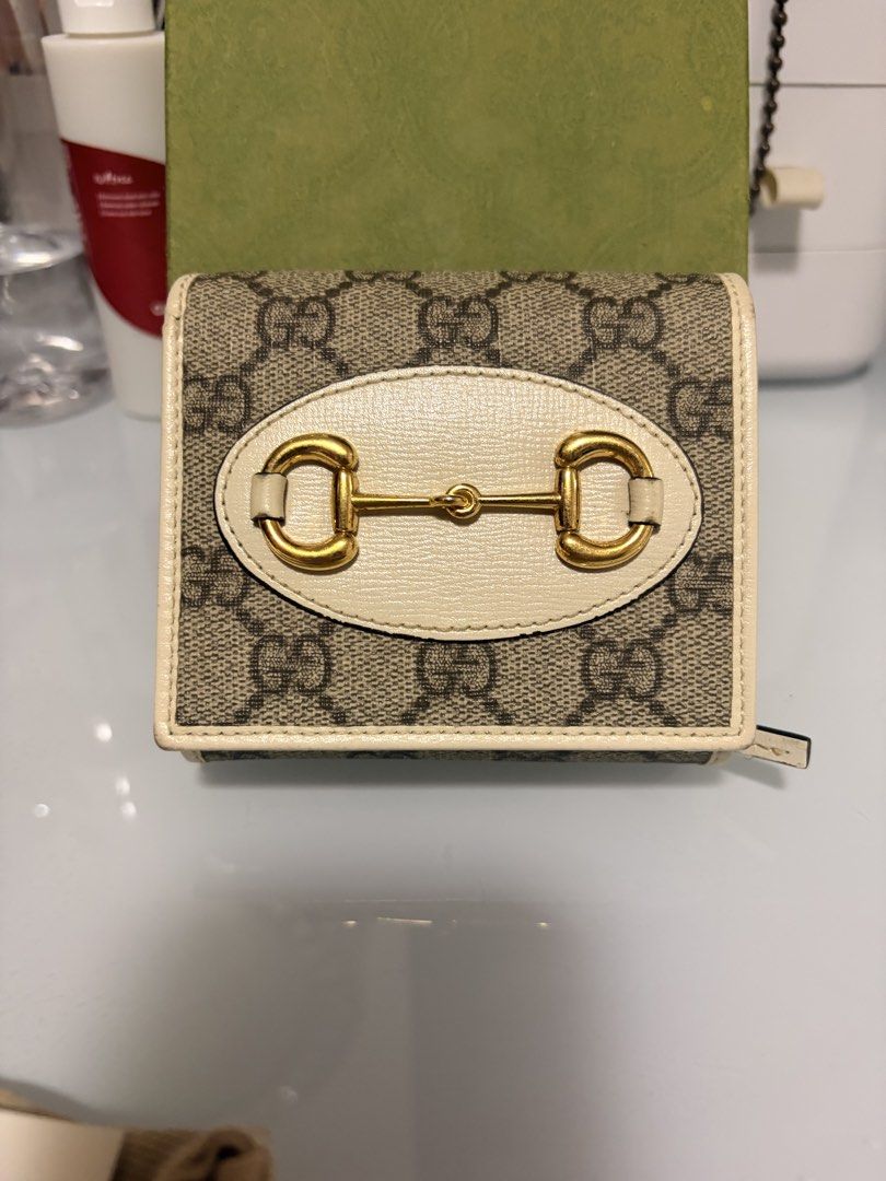 Gucci Horsebit Supreme Wallet (Category: Luxury Bags & Wallets) located in Manila. Submitted by mysuki_24 (Listing ID 1455851041, Image 2). Description: - Authentic Gucci wallet - Classic GG monogram canvas - Beige leather trim - Iconic horsebit detail on front - Interior card slots - Zip coin pocket - Comes with original box and dust bag - Ideal for everyday use This is a bigger size than the cardholder wallet and it has a cash pocket on the sid