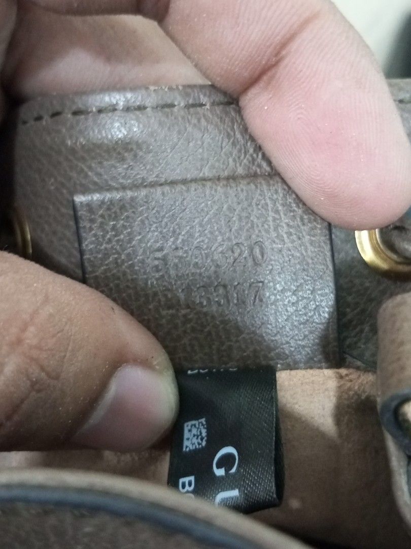 Gucci Monogram GG Supreme Canvas Bucket Bag (Category: Luxury Bags & Wallets) located in Bacolod City. Submitted by exequelgra46775 (Listing ID 1455762695, Image 3). Description: - Authentic Gucci bucket bag - Classic GG monogram canvas - Brown leather trim - Signature green and red stripe detail - Drawstring closure - Adjustable shoulder strap - Interior shows some signs of wear - Serial number visible in photos.