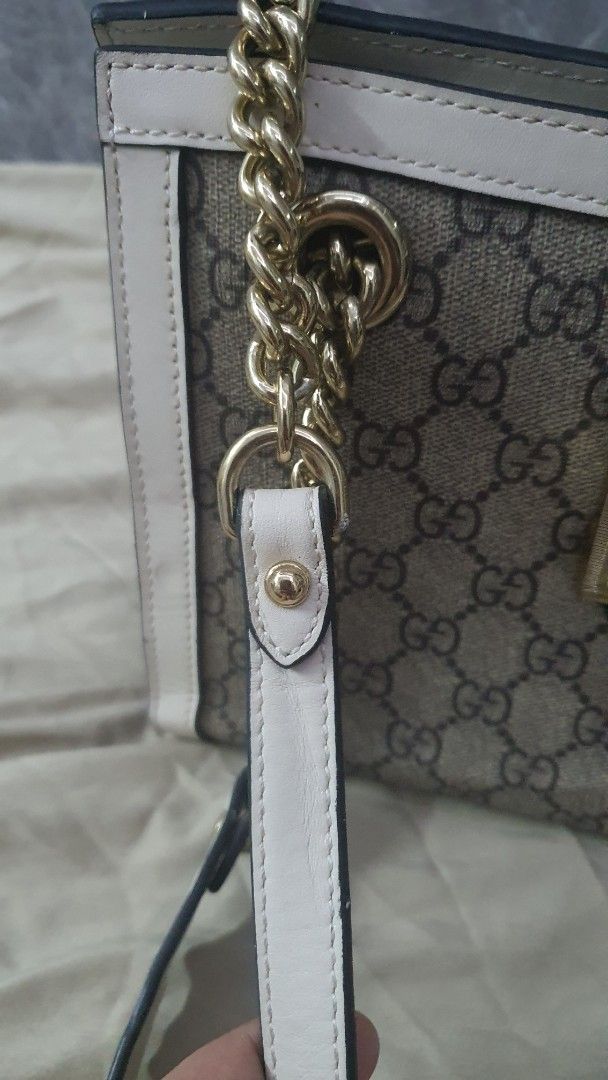 Gucci Padlock GG Supreme Canvas Shoulder Bag (Category: Luxury Bags & Wallets) located in Manila. Submitted by togodbethegloryteamjesus (Listing ID 1455682277, Image 2). Description: - Gucci shoulder bag - NGA please Self Authenticate - Classic GG Supreme canvas with white leather trim - Gold-tone hardware and chain strap - Interior with multiple compartments and coded - Secure lock closure on the front flap - Serial number visible inside for aut