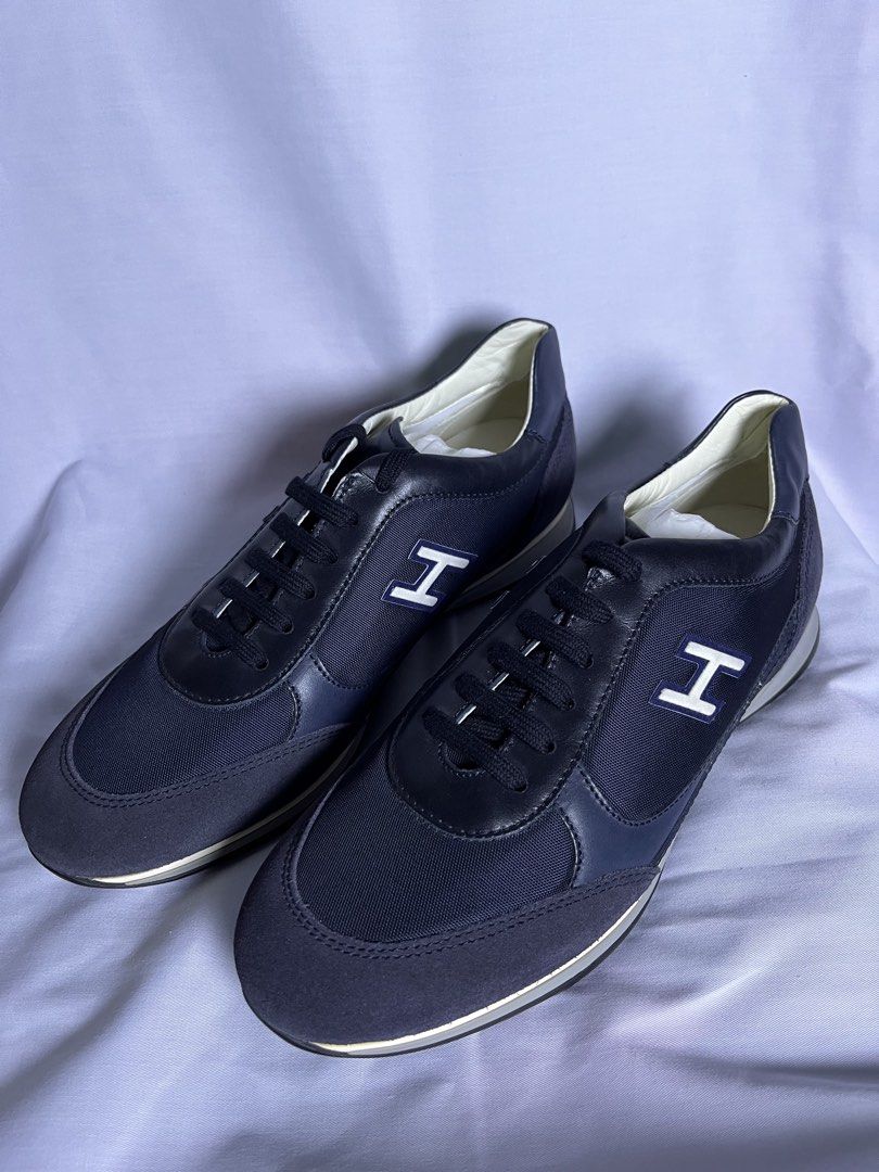 Hogan Navy Blue Leather & Suede Sneakers (Category: Sneakers) located in Bulacan. Submitted by stacksonracks_ph (Listing ID 1455704963, Image 1). Description: - Navy blue Hogan sneakers - Made in Italy - Leather and suede upper - Classic 'H' logo on the side - Comfortable and stylish - Perfect for casual wear.