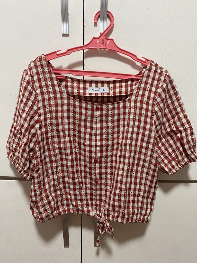 Huru Red Gingham Square Neck Tie Front Puff Sleeve Top Size L (Category: Blouses) located in Antipolo. Submitted by ckaydl (Listing ID 1455747161, Image 1). Description: - Cute red and white gingham top - Brand: Huru - Features: Square neckline, puff sleeves, button front, tie hem detail - Size: L (but fits medium frames) 📍Mambugan antipolo mop: gcash mod: J&T or pick-up (c/o buyer).