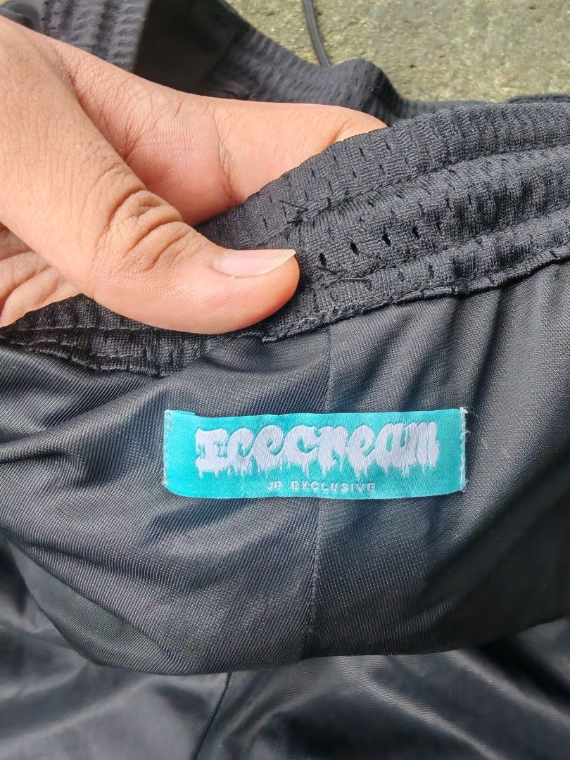 ICE CREAM "Running Dog" Mesh Cargo Shorts (Category: Shorts) located in Tarlac. Submitted by dhanmar.125 (Listing ID 1455701890, Image 3). Description: - Brand: ICE CREAM - Style: Black Mesh Cargo Shorts - Features: Iconic "Running Dog" graphic on front - Waist: Elastic waistband with drawstring - Pockets: Side cargo pockets - Origin: Made in China - Ideal for: Casual wear or sports.