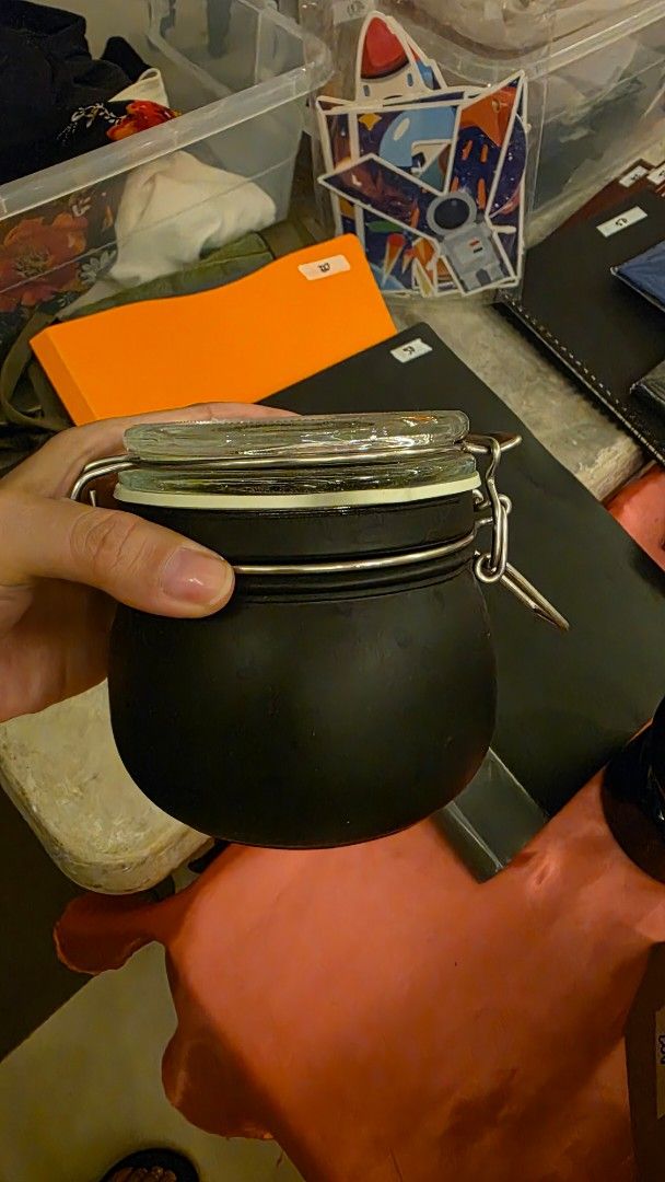 IKEA Black Glass Jar with Clamp Lid (Category: Food Organization & Storage) located in Muntinlupa City. Submitted by dogsmakemehappy (Listing ID 1455824200, Image 1). Description: - Airtight black glass jar with clamp lid - Features a rubber seal for freshness - Ideal for storing dry goods or as a decorative item - Bottom has text and numbers - Capacity: Approximately 0.1 liters - 2 pcs available .