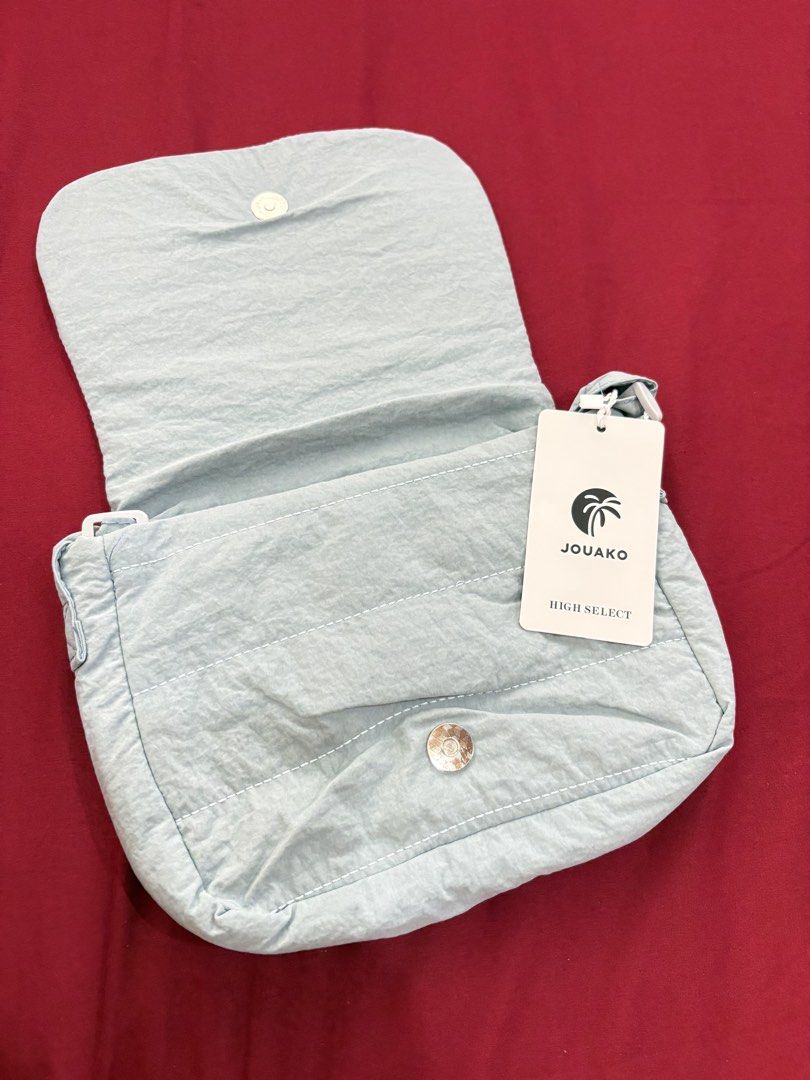 JOUAKO HIGH SELECT Light Blue Puffer Shoulder Bag (Category: Shoulder Bags) located in Calamba. Submitted by tripleceedoubletwo (Listing ID 1455690269, Image 3). Description: - Light blue puffer shoulder bag from JOUAKO HIGH SELECT - Magnetic snap closure on flap Dimension: 10x2x8 inches .