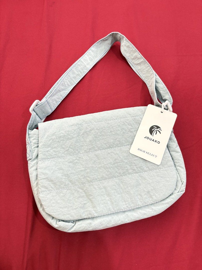 JOUAKO HIGH SELECT Light Blue Puffer Shoulder Bag (Category: Shoulder Bags) located in Calamba. Submitted by tripleceedoubletwo (Listing ID 1455690269, Image 1). Description: - Light blue puffer shoulder bag from JOUAKO HIGH SELECT - Magnetic snap closure on flap Dimension: 10x2x8 inches .