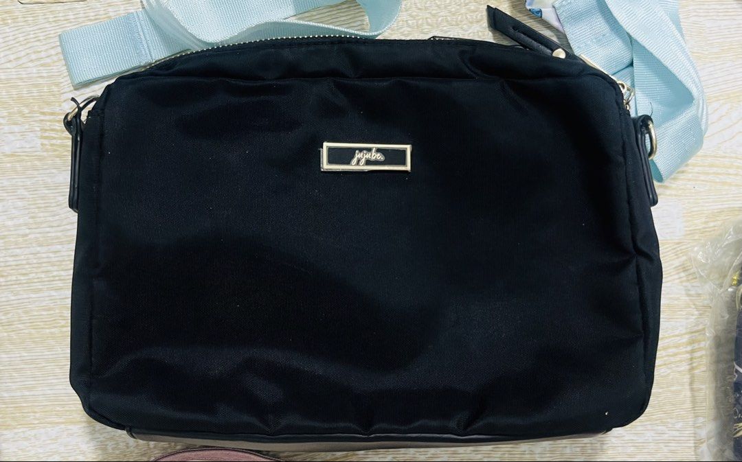 Jujube Eco Clutch Black Bag (Category: Cross-body Bags) located in Mandaluyong City. Submitted by clairie03 (Listing ID 1455696467, Image 1). Description: Signs of usage on D ring With detachable adjustable long strap Used as clutch or crossbody.