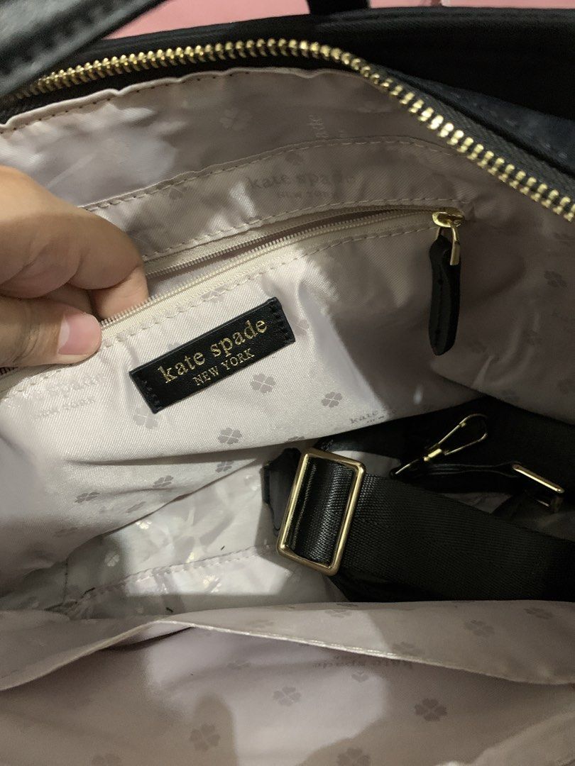 Kate Spade Black Nylon Tote Bag (Category: Tote Bags) located in Rodriguez. Submitted by adorkableee (Listing ID 1455831996, Image 2). Description: - Brand: Kate Spade - Color: Black - Material: Nylon with leather handles - Exterior Pockets: Zippered front pocket, side pockets - Interior Pockets: Zip pocket, slip pockets - Hardware: Gold - Included: Crossbody strap Good as new!.