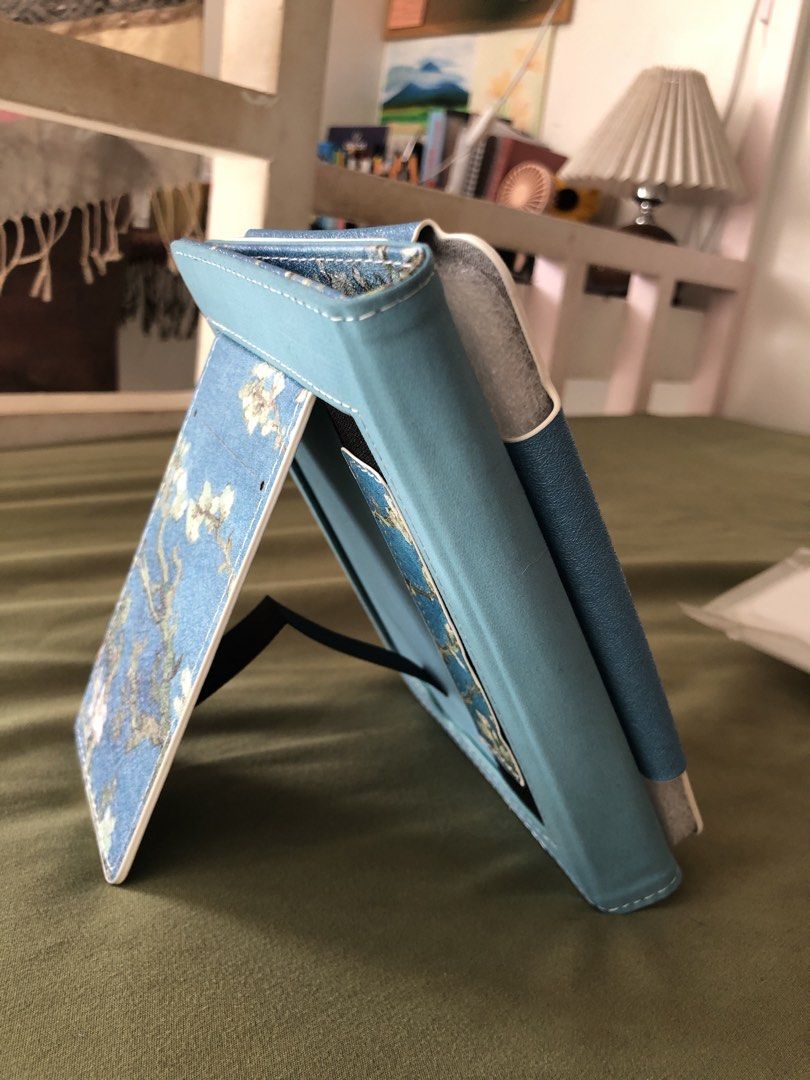[KINDLE CASE] MoKo Case for 6” Kindle (8th/10th/11th Gen) (Category: Other Accessories) located in Manila. Submitted by casabaraly00528 (Listing ID 1455733537, Image 3). Description: - Beautiful Van Gogh Almond Blossom print on a blue cover. - Convenient stand feature for easy viewing. - Interior slots for cards or notes. RFS: Incompatible with my current kindle model. Never been used, opened just for pictures..