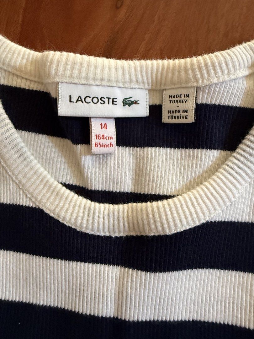 Lacoste Striped Ribbed Tank Top Size 14 (Category: Sleeveless) located in Makati City. Submitted by larcie (Listing ID 1455695299, Image 3). Description: - Navy and white striped ribbed tank top by Lacoste - Sleeveless with crew neck - Iconic Lacoste crocodile logo on the front - Made in Turkey - Size 14 (fits 164cm/65inch) - Ideal for casual outfits -used only twice.
