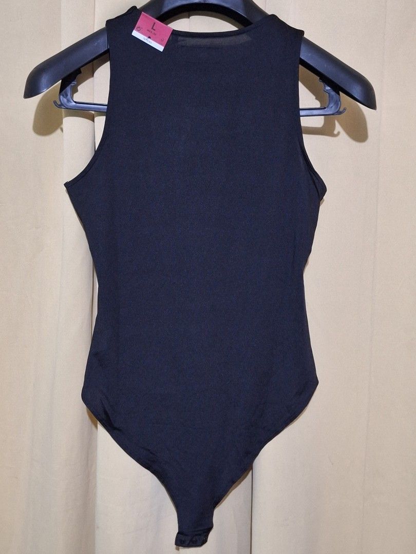 Lefties Black Sleeveless Bodysuit Size L (Category: Sleeveless) located in Manila. Submitted by viiiieve (Listing ID 1455838676, Image 3). Description: - Black sleeveless bodysuit from Lefties - Size L (MEX 30) - Simple and versatile design - Perfect for layering or wearing on its own - Comfortable fabric - Wardrobe essential.