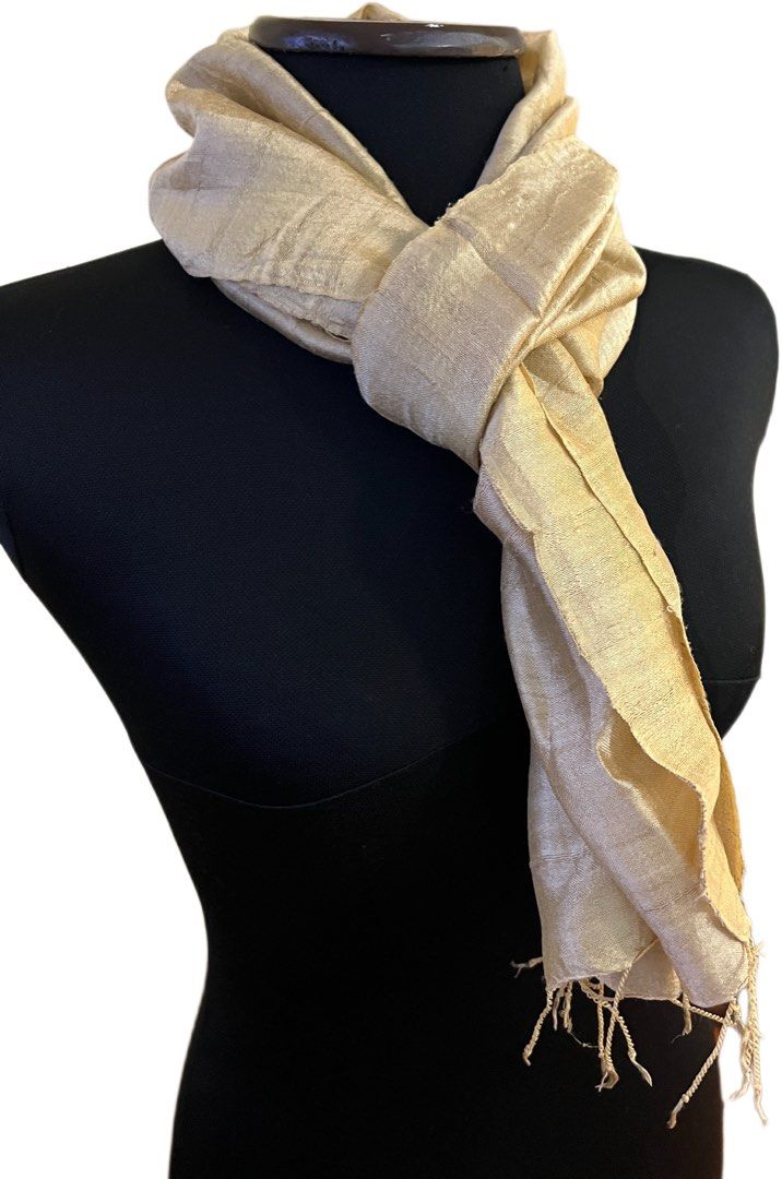 Light Beige Silk Scarf with Fringed Ends (Category: Scarves) located in Muntinlupa City. Submitted by chiaraa400 (Listing ID 1455815502, Image 1). Description: - Light beige scarf - raw Thai silk - Fringed edges on both ends - Approximately 66 inches long x 14 inches wide - Perfect accessory to complete any look.