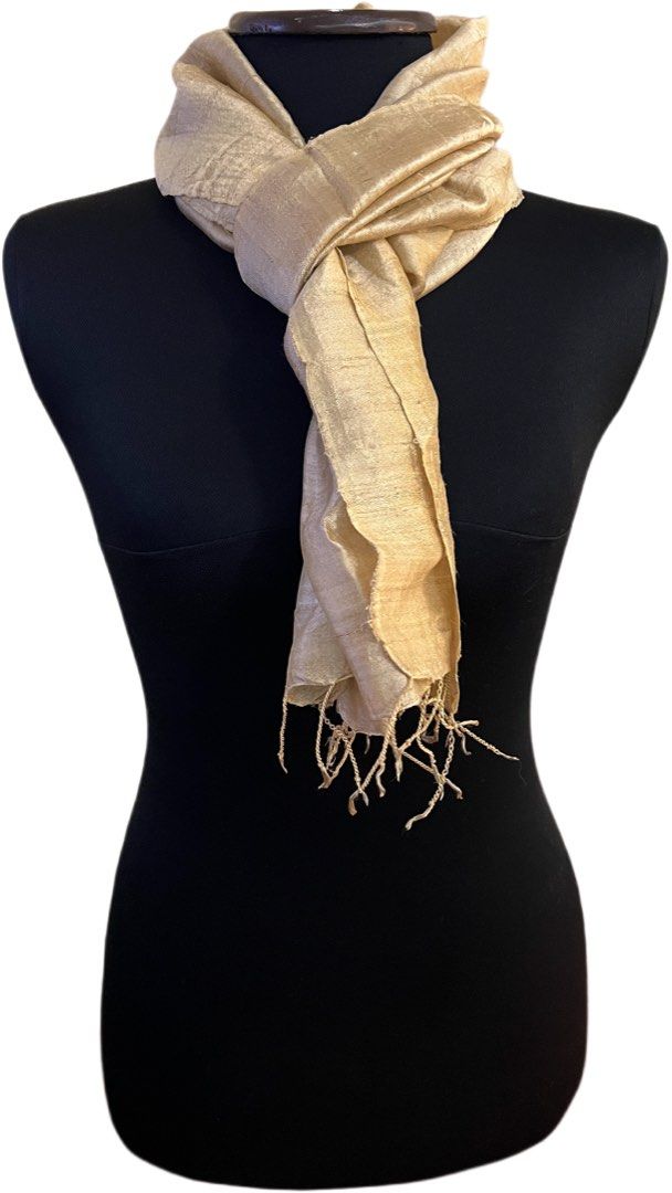 Light Beige Silk Scarf with Fringed Ends (Category: Scarves) located in Muntinlupa City. Submitted by chiaraa400 (Listing ID 1455815502, Image 2). Description: - Light beige scarf - raw Thai silk - Fringed edges on both ends - Approximately 66 inches long x 14 inches wide - Perfect accessory to complete any look.