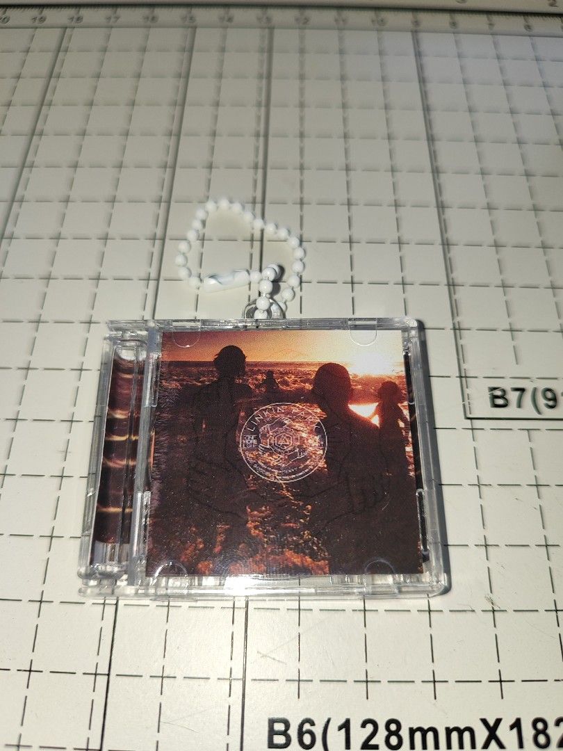 Linkin Park One More Light CD Keychain (Category: CDs & DVDs) located in Santo Domingo. Submitted by nfcminicdkeychainsbytin (Listing ID 1455851500, Image 1). Description: - Linkin Park 'One More Light' CD keychain - Features a stylish beaded strap - CD case opens up to reveal details - Tracklist shown in photos - Small and portable design - Ideal for Linkin Park fans.