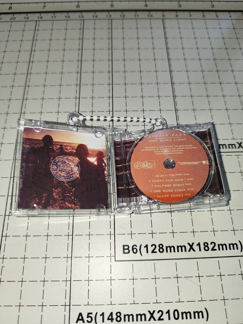 Linkin Park One More Light CD Keychain (Category: CDs & DVDs) located in Santo Domingo. Submitted by nfcminicdkeychainsbytin (Listing ID 1455851500, Image 2). Description: - Linkin Park 'One More Light' CD keychain - Features a stylish beaded strap - CD case opens up to reveal details - Tracklist shown in photos - Small and portable design - Ideal for Linkin Park fans.