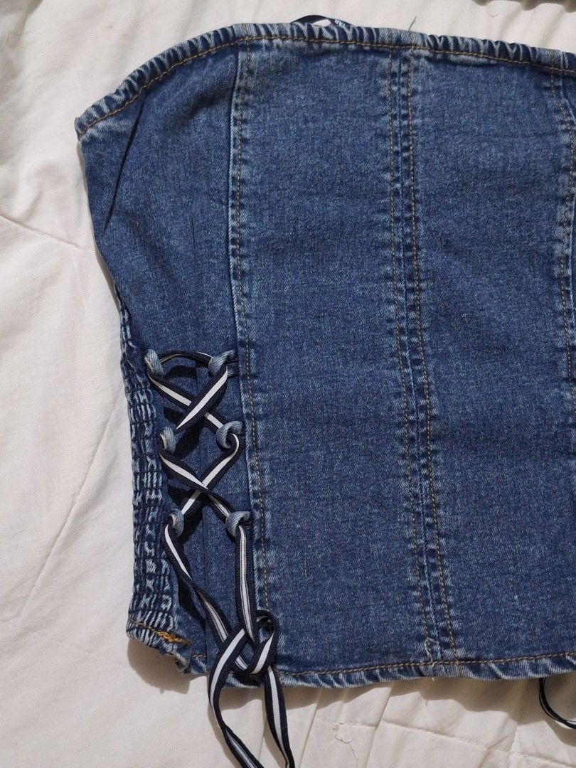 Lone Star Denim Corset Top Size M (Category: Others Tops) located in Manila. Submitted by viiiieve (Listing ID 1455837793, Image 3). Description: - Denim corset top from Lone Star - Features smocked back - Lace-up details on front and sides - Size: Medium (M) - Versatile: Great for layering or wearing on its own -remkvabke ties on the side.