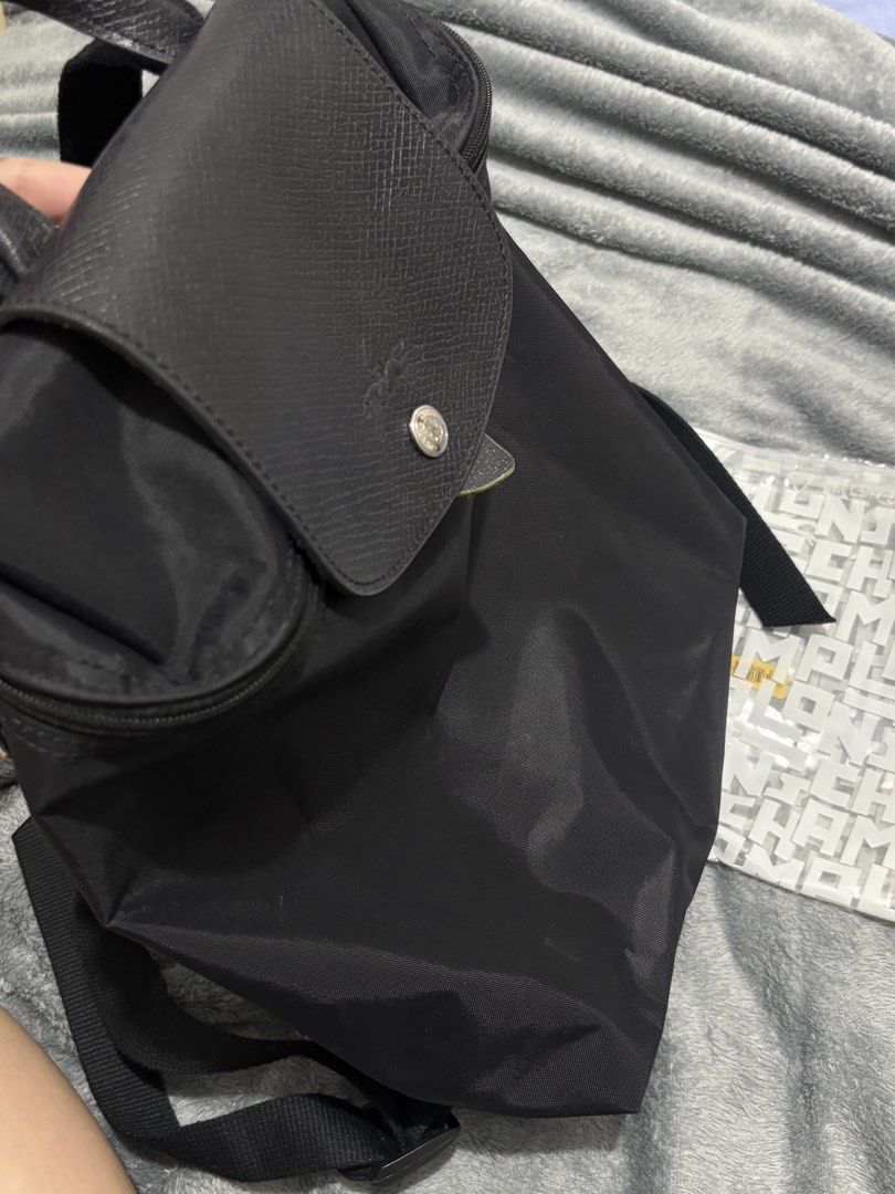 Longchamp Le Pliage Backpack Black (Category: Backpacks) located in Manila. Submitted by treex_ (Listing ID 1455796995, Image 2). Description: - Authentic Black Longchamp Le Pliage Backpack - Durable Nylon Body with Leather Trim - Top Handle and Adjustable Shoulder Straps - Secure Zipper Closure - Includes Clear Pouch with Longchamp Logo - Ideal for Everyday Use or Travel.