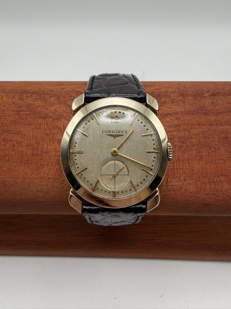 Longines Rare Vintage Solid 14k Gold 1950s Manual Wind Men (Category: Luxury Watches) located in Manila. Submitted by rj_authenticwatchesandmore (Listing ID 1455849249, Image 2). Description: Vintage Longines 1950s Manual Wind - Approximately made in the 1950s - Made from Solid 14k yellow gold - Caseback marked with “14k Gold” - Beautiful silver dial, with even light patina - Keeps time - Case diameter 32.5mm - Manual Wind Movement - Weight (watc