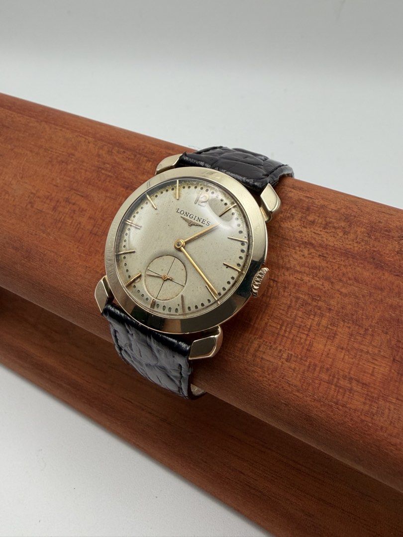 Longines Rare Vintage Solid 14k Gold 1950s Manual Wind Men (Category: Luxury Watches) located in Manila. Submitted by rj_authenticwatchesandmore (Listing ID 1455849249, Image 3). Description: Vintage Longines 1950s Manual Wind - Approximately made in the 1950s - Made from Solid 14k yellow gold - Caseback marked with “14k Gold” - Beautiful silver dial, with even light patina - Keeps time - Case diameter 32.5mm - Manual Wind Movement - Weight (watc
