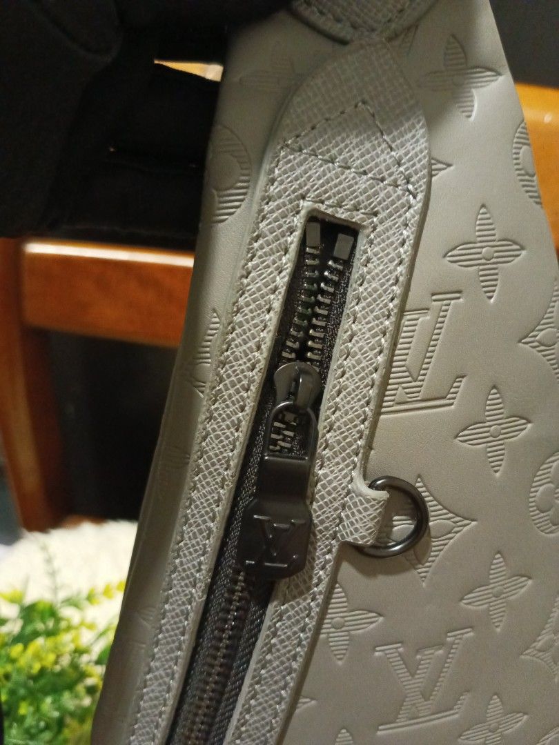 Louis Vuitton Monogram Embossed Sling Bag Grey (Category: Luxury Bags & Wallets) located in Digos. Submitted by chihanu (Listing ID 1455829263, Image 3). Description: - Louis Vuitton sling bag - Classic monogram pattern - Zip closure - Adjustable strap - Ideal for everyday use - Made in France.