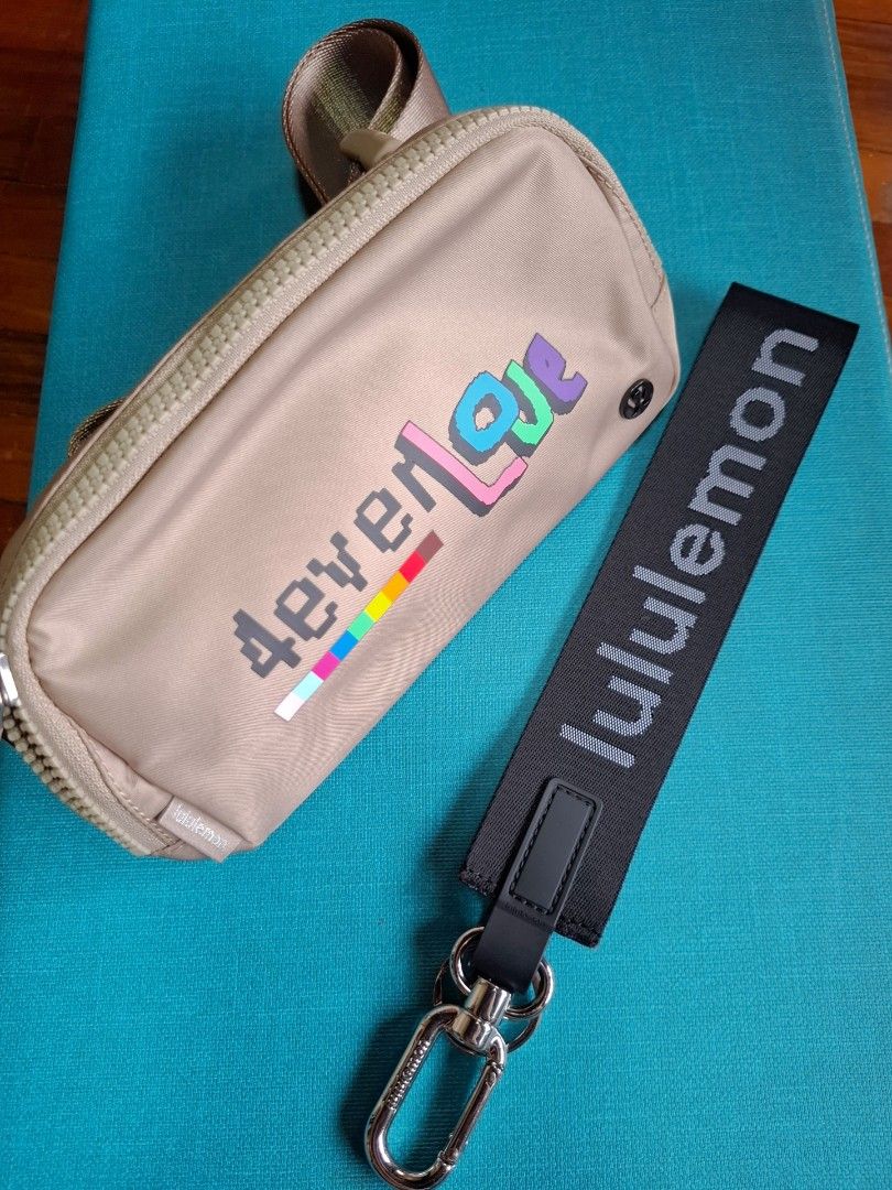 Lululemon Belt Bag Pouch with Keychain (Category: Purses & Pouches) located in Makati City. Submitted by itemsforless2025 (Listing ID 1455690008, Image 2). Description: - Lululemon pouch and keychain set - Pouch: Light tan with colorful graphic design, zippered closure, and small strap - Keychain: Black with Lululemon logo - Ideal for organizing small essentials - like new no tags.