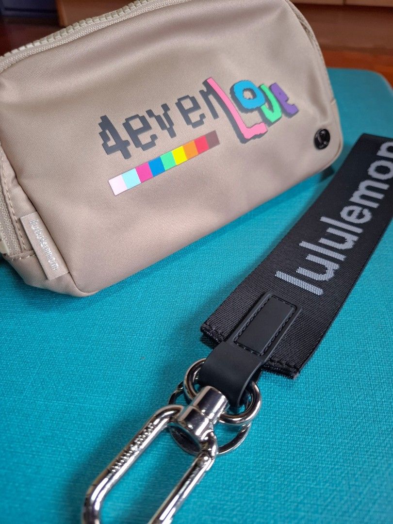 Lululemon Belt Bag Pouch with Keychain (Category: Purses & Pouches) located in Makati City. Submitted by itemsforless2025 (Listing ID 1455690008, Image 3). Description: - Lululemon pouch and keychain set - Pouch: Light tan with colorful graphic design, zippered closure, and small strap - Keychain: Black with Lululemon logo - Ideal for organizing small essentials - like new no tags.