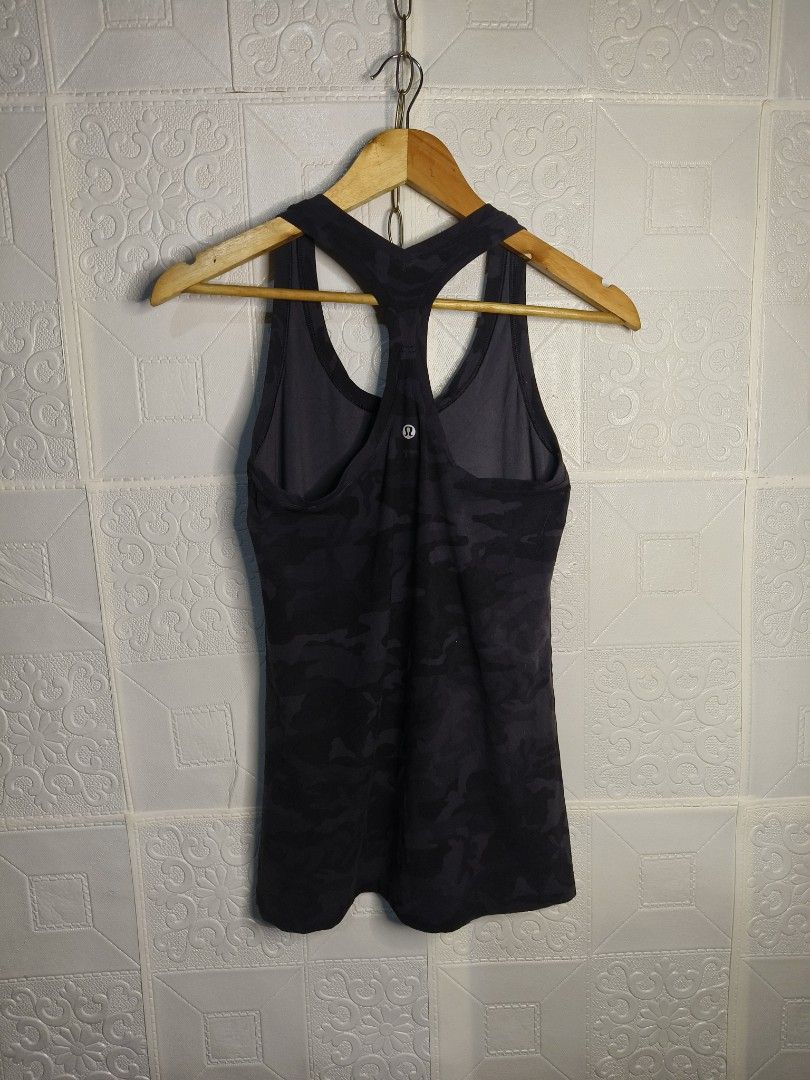 Lululemon Camouflage Racerback Tank top (Category: Activewear) located in Davao. Submitted by tsupremacy (Listing ID 1455789417, Image 2). Description: Lululemon Camouflage Racerback Tank top - Size XS to Small - Excellent Condition - Color may vary due to lighting. - Colo rate: 9/10 - Width 15 - Length 26 - Need wash only - Issue: cut washtag.
