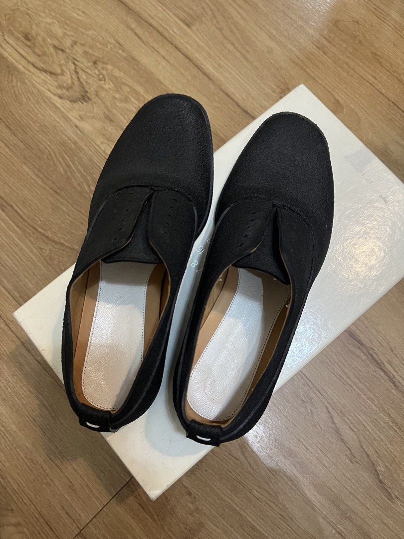 Maison Margiela Black Rubber Oxfords (Category: Loafers) located in Las Pinas. Submitted by ekekstuff (Listing ID 1455727498, Image 2). Description: - Brand: Maison Margiela - Color: Black - Style: Oxfords - Feature: good for the rain, no laces - Material: Rubber - Origin: Made in Italy - Size: 37.5 - Condition: Comes with original box - Perfect for: Adding an avant-garde and unique statement to your fashion-forward outfits..