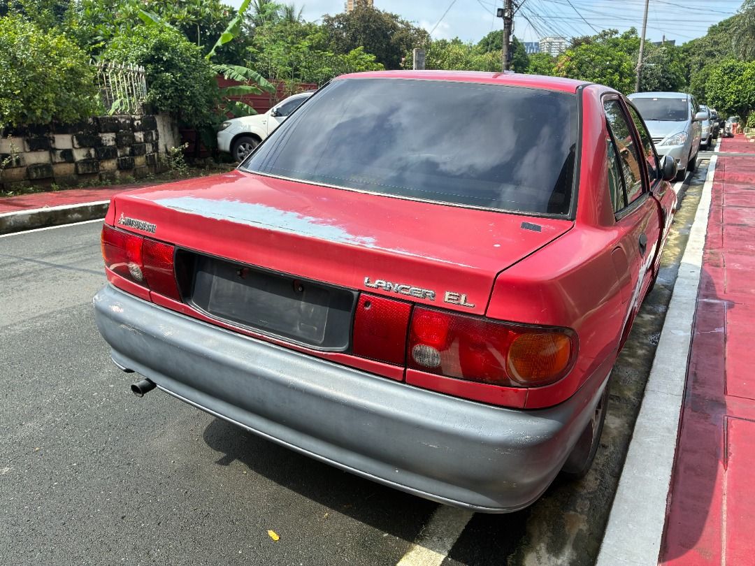 Mitsubishi Lancer EL Manual (Category: Used Cars) located in Quezon City. Submitted by jiggyboy11 (Listing ID 1450740931, Image 2). Description: Selling unit as-is For scrap Not eligible for transfer of ownership (owner deceased) No papers Not in running condition Needs engine overhaul due to broken timing belt Broken compressor Broken rear shock absorber Manual transmission Carburetor type Location: Near OLPH Parish, Project 8, Quezon City.