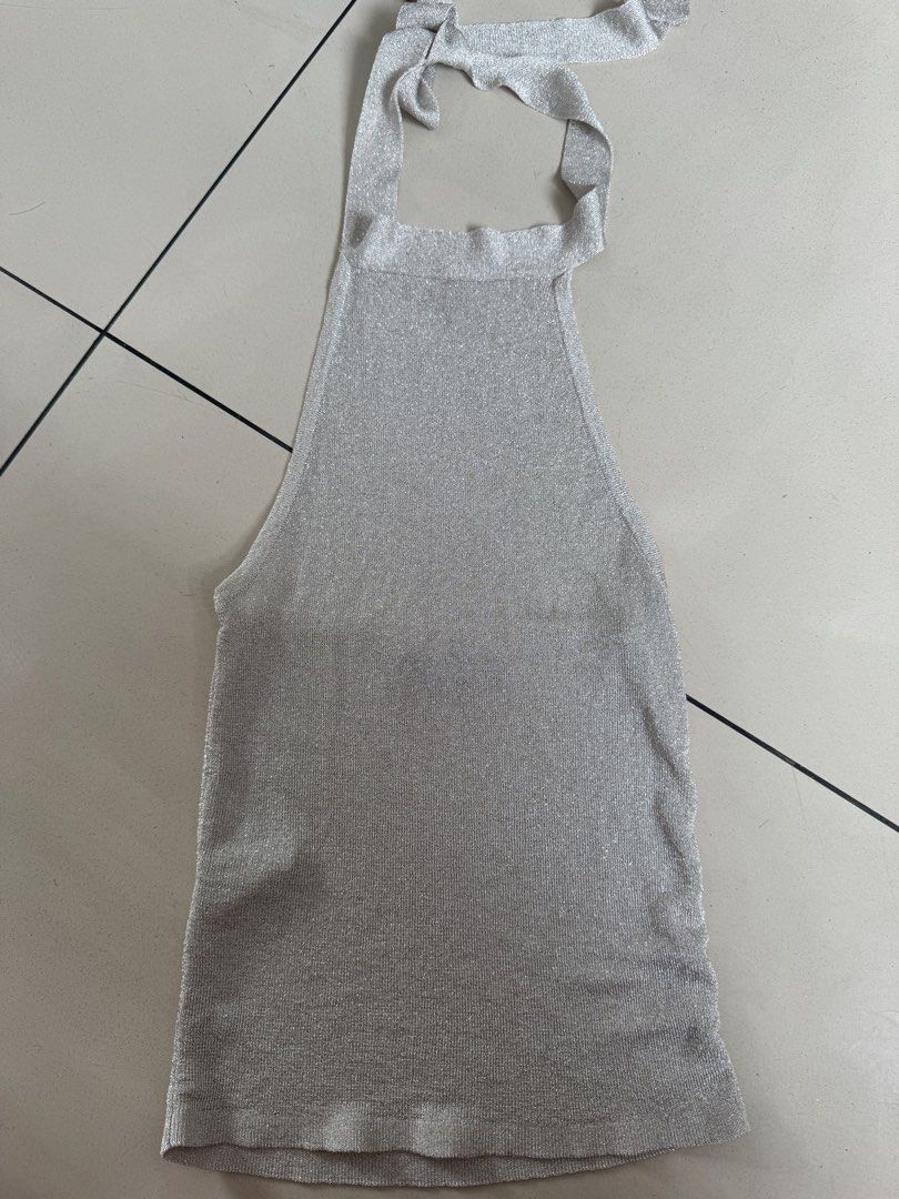 MNG Silver Sparkly Halter Neck Top XS (Category: Sleeveless) located in Manila. Submitted by decluterthings888 (Listing ID 1455675637, Image 2). Description: - Sparkly silver halter neck top - Brand: MNG - Size: XS - Ties at the back of the neck - Features a beautiful shimmer - Ideal for parties or a night out.