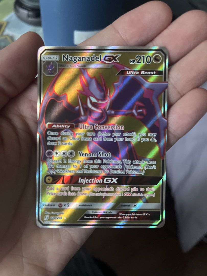 Naganadel GX Full Art 230/236 (Category: Raw Singles) located in Manila. Submitted by ignasho (Listing ID 1455697757, Image 3). Description: - Naganadel GX Full Art Pokemon Card - Card is protected in a sleeve, binder condition - Torkoal 230/236.