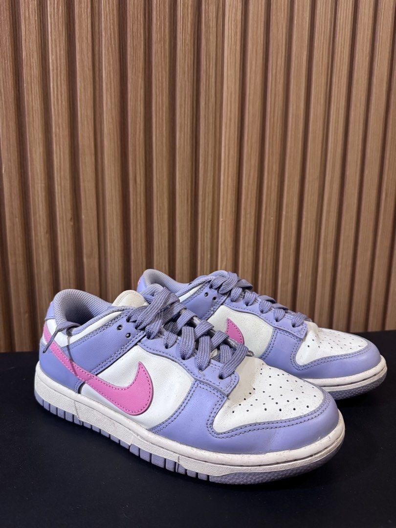 Nike Dunk Low Lilac Pink White (Category: Sneakers) located in Silay City. Submitted by declutterwithm3 (Listing ID 1455850746, Image 2). Description: - Classic low-top Nike Dunks - Colorway: Lilac, pink, and white - Features a pink Nike swoosh - Lilac laces for a pop of color - Perforated toe box - Nike branding on heel tab - Ideal for casual wear.
