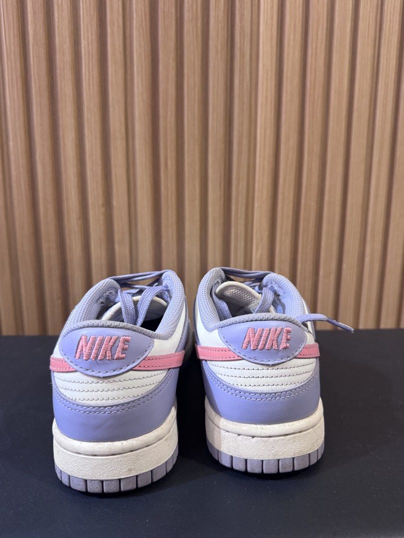 Nike Dunk Low Lilac Pink White (Category: Sneakers) located in Silay City. Submitted by declutterwithm3 (Listing ID 1455850746, Image 3). Description: - Classic low-top Nike Dunks - Colorway: Lilac, pink, and white - Features a pink Nike swoosh - Lilac laces for a pop of color - Perforated toe box - Nike branding on heel tab - Ideal for casual wear.