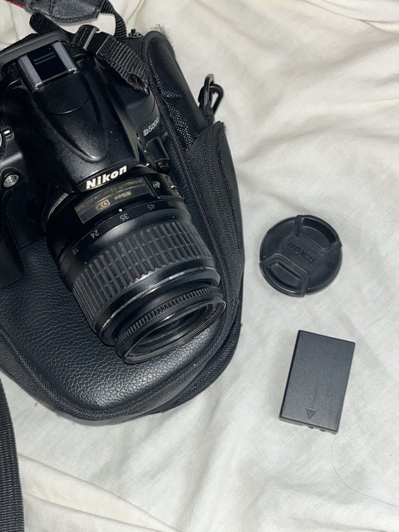 Nikon D5000 DSLR Camera with Lens and Accessories (Category: Cameras) located in Bongabong. Submitted by theamariano (Listing ID 1455813689, Image 1). Description: - Nikon D5000 DSLR camera - Includes a lens - Comes with a camera bag - Battery included - Lens cap provided - Charger included Issue: Lcd problem Rfs: Upgrade .