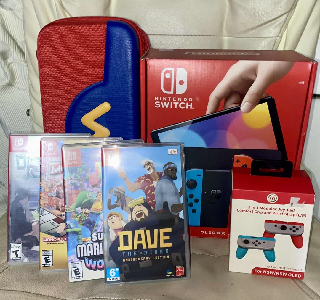 Nintendo Switch OLED + Games + Accessories (Category: Nintendo) located in Marikina City. Submitted by jumpfa77 (Listing ID 1455811593, Image 1). Description: ⭐️ Nintendo Switch OLED (BLUE&RED) ⭐️ Complete Set with Box 💍 Accessories 💍 Pouch Super Mario Theme Translucent Full Jelly Case Grip 2 Players JoyCon Grip Controller 🎮 Games with Cases 🎮 Super Mario Wonder Dave the Diver Monopoly Dual Version Disaster Report 4.