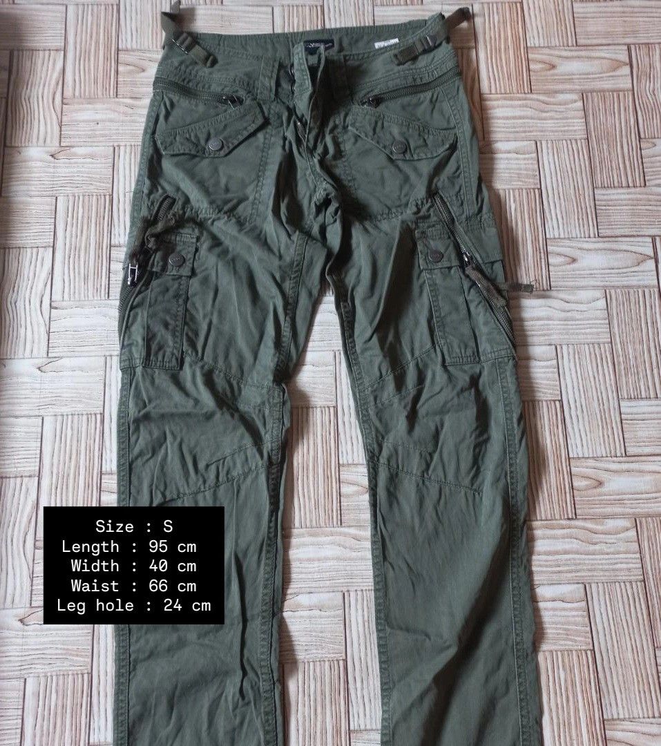 Olive Green Cargo Pants Size S | Y2k , Acubi (Category: Other Bottoms) located in Rizal. Submitted by magi_declutters (Listing ID 1455724216, Image 1). Description: - Olive green cargo pants - Multiple pockets with zippers and buttons - Adjustable straps at the waist - Leg opening: 24 cm - Length: 95 cm - Waist: 66 cm - Width: 40 cm.