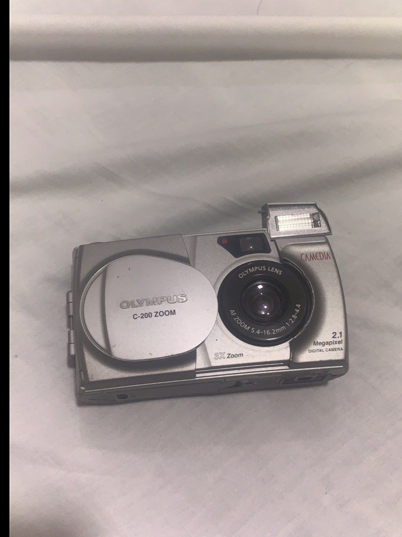Olympus C-200 Zoom DigiCam (Untested) (Category: Cameras) located in Manila. Submitted by trueeagle-8c91 (Listing ID 1455854426, Image 1). Description: - Olympus C-200 Zoom digital camera - 2.1 megapixel resolution - 3x optical zoom - Olympus AF Zoom 5.4-16.2mm 1:2.8-4.4 lens - Compact and portable design - Ideal for everyday photography - Uses 4 AA Batteries - Vintage for collectors - Not sure if it works - no batteries for testing -what you see