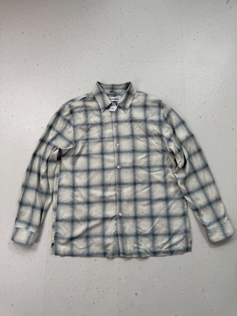 Our Legacy Forever Plaid Viscose Shirt (Category: Luxury Apparel) located in Makati City. Submitted by donda.archives (Listing ID 1455693576, Image 1). Description: -100% viscose. -Natural shell buttons. -Strictly symmetrical plaid. -Very soft, breathable, and silky. Very soft, relatively thin. 100% viscose feels very comfortable, but it has a downside—it wrinkles easily, which is a characteristic of Tencel fabric. A vertical black line in the ce