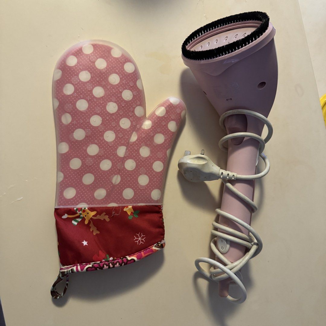 Philips steamer (Category: Irons & Steamers) located in Singapore. Submitted by fourthtrimester (Listing ID 1455799708, Image 1). Description: - Philips handheld garment steamer - Pastel pink colour - Comes with a polka dot oven mitt for protection - Ideal for quick wrinkle removal - Easy to use and store - Great for travel or daily use.
