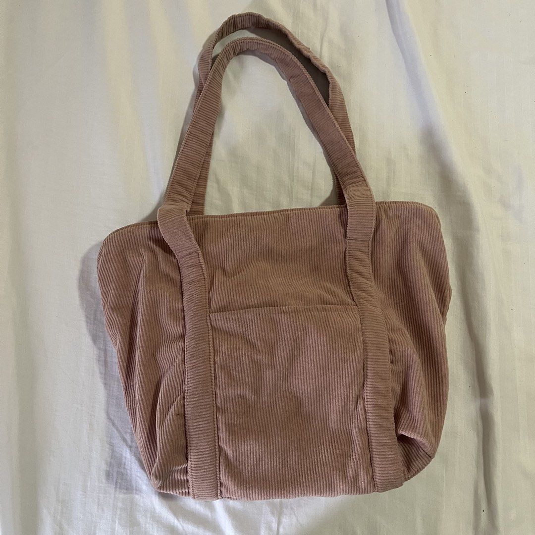 Pink Corduroy Tote Bag (Category: Tote Bags) located in Bacolor. Submitted by declutteryin (Listing ID 1455753024, Image 1). Description: Cute pink corduroy tote bag from CEDO (ig) Front pocket for easy access Pink color is more muted in person Very spacious With fabric lining inside With signs of use .