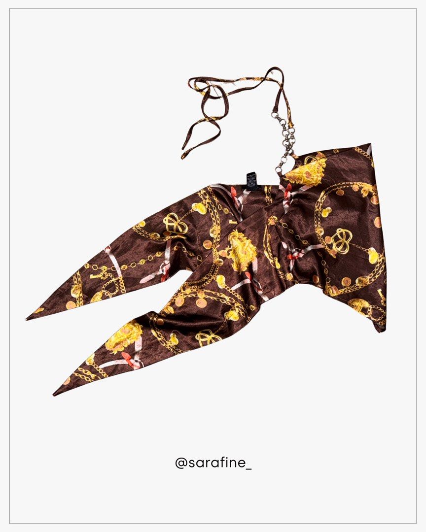 Rue21 Brown Baroque Chain Print Cowl Neck Triangle Top (Category: Sleeveless) located in Manila. Submitted by sarafine_ (Listing ID 1455834862, Image 3). Description: Rue21 Brown Baroque Chain Print Cowl Neck Triangle Top * Well used but still in good condition * Brown satin-like fabric with gold chain/baroque-inspired print * Cowl neckline * Tie straps with chain detailing * Back-tie closure * Photos show the actual item and its current conditio