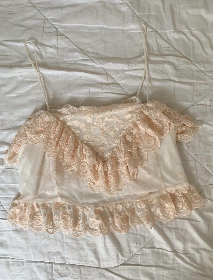 Sheer Lace Ruffle Crop Top Camisole (Category: Others Tops) located in Binan City. Submitted by byhiraeth (Listing ID 1455793761, Image 1). Description: - Cute sheer crop top - Delicate floral lace overlay with ruffles - Adjustable spaghetti straps - Versatile for layering or wearing on its own - Adds a feminine touch to any outfit - Ideal for summer or a night out.