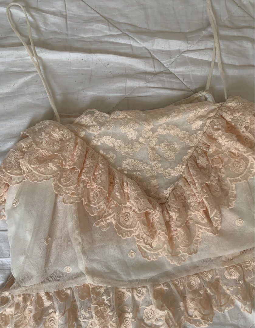 Sheer Lace Ruffle Crop Top Camisole (Category: Others Tops) located in Binan City. Submitted by byhiraeth (Listing ID 1455793761, Image 2). Description: - Cute sheer crop top - Delicate floral lace overlay with ruffles - Adjustable spaghetti straps - Versatile for layering or wearing on its own - Adds a feminine touch to any outfit - Ideal for summer or a night out.