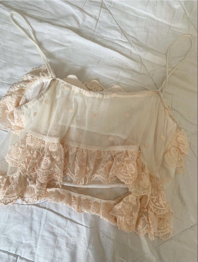 Sheer Lace Ruffle Crop Top Camisole (Category: Others Tops) located in Binan City. Submitted by byhiraeth (Listing ID 1455793761, Image 3). Description: - Cute sheer crop top - Delicate floral lace overlay with ruffles - Adjustable spaghetti straps - Versatile for layering or wearing on its own - Adds a feminine touch to any outfit - Ideal for summer or a night out.