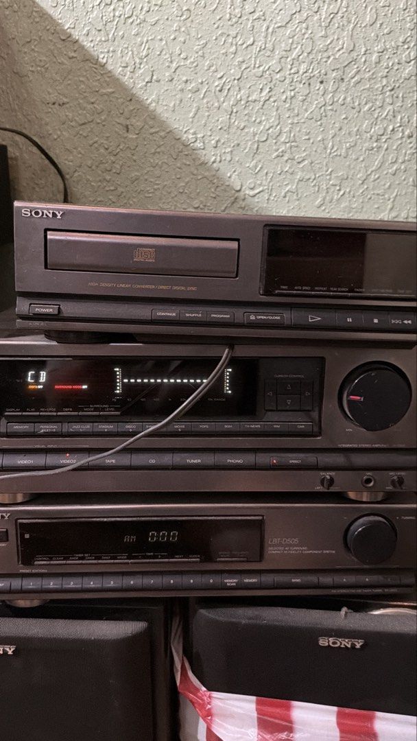 Sony CD Player, Amplifier, and Cassette Deck (Category: Soundbars, Speakers & Amplifiers) located in Manila. Submitted by purestorm_7606e4 (Listing ID 1455768272, Image 1). Description: - Complete vintage Sony audio system stacked together. - Features a HIGH DENSITY LINEAR CONVERTER DIRECT DIGITAL SYNC CD player. - Amplifier with display showing CD and SURROUND SOUND capabilities. - Includes a Sony LBT-D505 cassette deck. - Ideal for creating a c