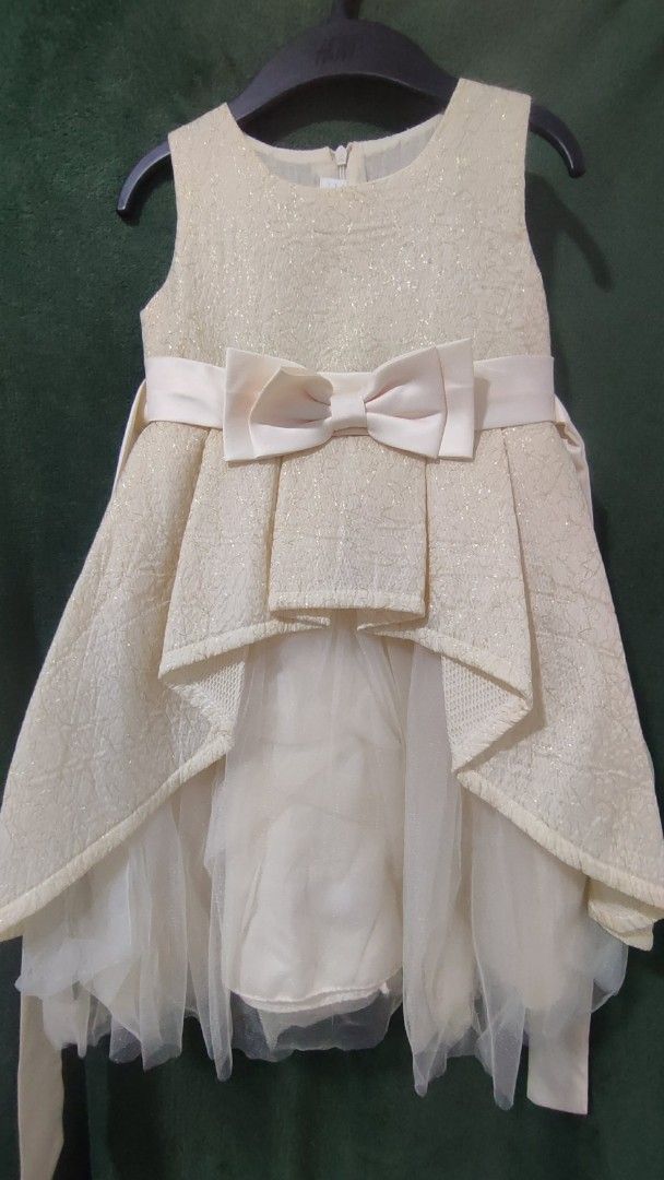 Sparkly Party Dress with Bow (Category: Babies & Kids Fashion) located in Rizal. Submitted by zhellieme (Listing ID 1455776183, Image 1). Description: - Beautiful sparkly dress for little girls - Sleeveless design with a front bow - Layered tulle skirt hem - Ideal for parties and special occasions - Zipper closure at the back - Comes with a matching sash.