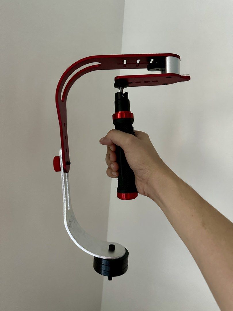 Steadyvid EX Video Stabilizer (Category: Gimbals & Stabilizers ) located in Paranaque City. Submitted by daenydaeny (Listing ID 1455768245, Image 3). Description: - Steadyvid EX Video Stabilizer - Supports DSLRs and camcorders up to 2.1 lbs - Lightweight aluminum body (1.83 lbs) - Padded handle with comfort grip - Finished counter-weight for smooth motion - Includes spirit level and thumb stabilizer.
